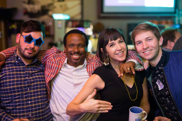 Group of four friends smiling and posing together at the Love Bomb 2017 event, showcasing community spirit and support for My Voice Music.